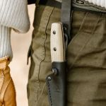 Morakniv Dangler 10 with Button being used on the belt